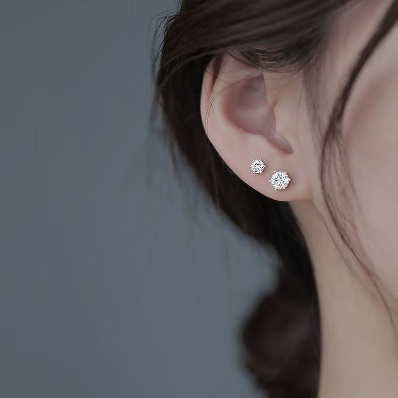 A moissanite stud worn on the earlobe