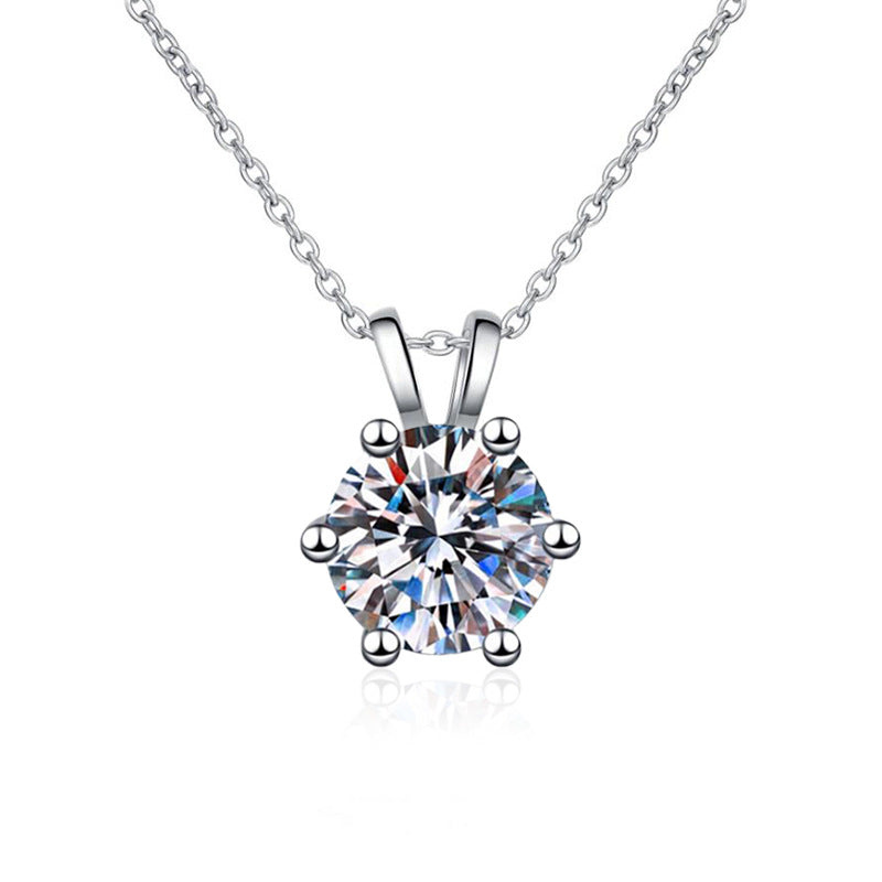 Moissanite pendant photographed on white, showing its fire