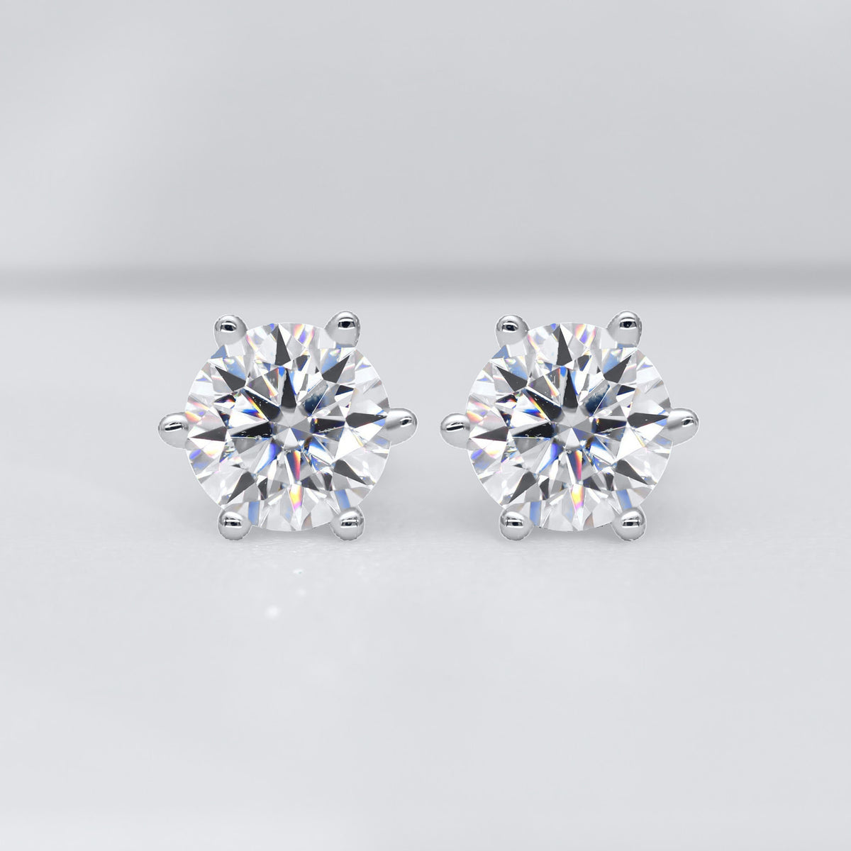The pair of 5 mm moissanite studs, close up